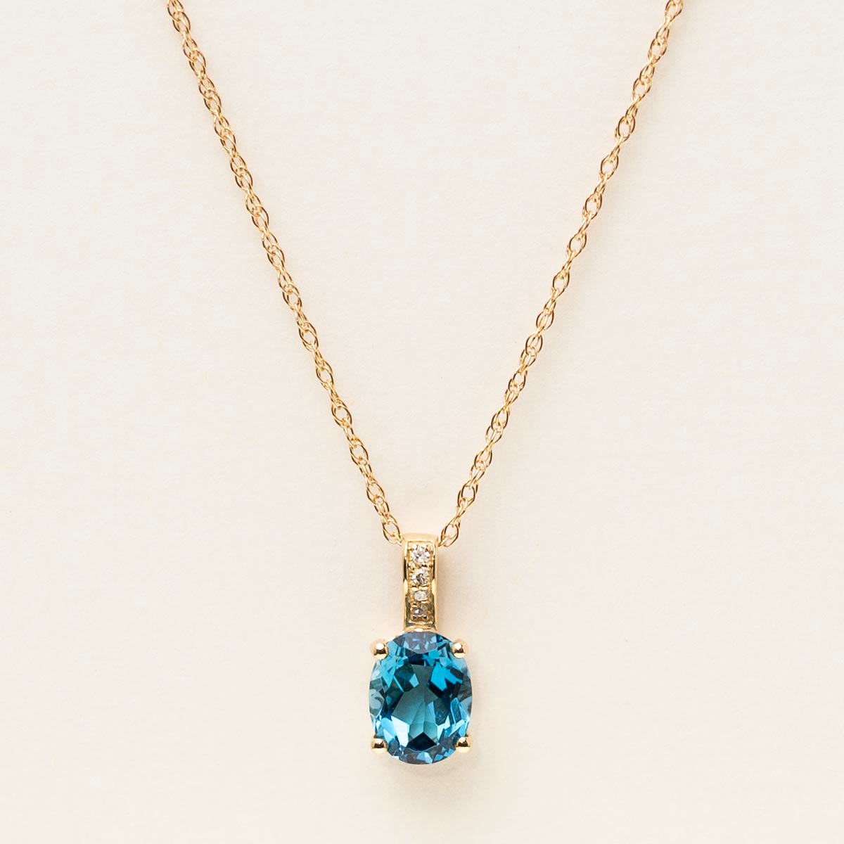 Oval London Blue Topaz Necklace in 14kt Yellow Gold with Diamonds