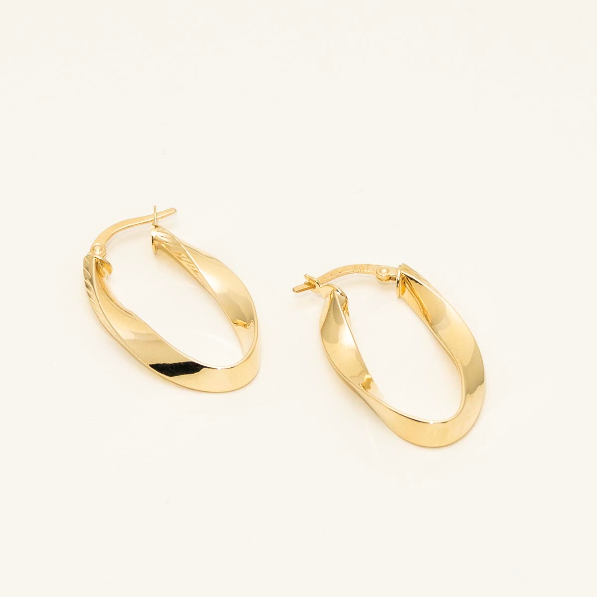 Diamond Cut Oval Twist Hoop Earrings in 14kt Yellow Gold