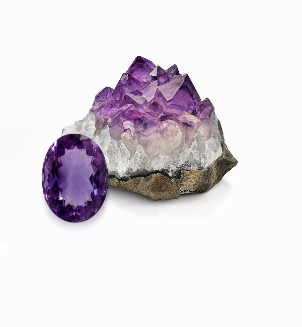 Purple amethyst crystal and polished gemstone on a white background
