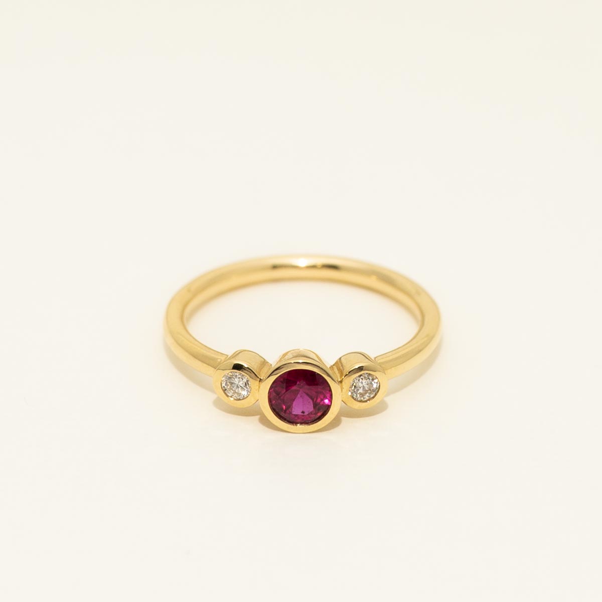 Ruby Bezel Ring in 18kt Yellow Gold with Diamonds (1/10ct tw)