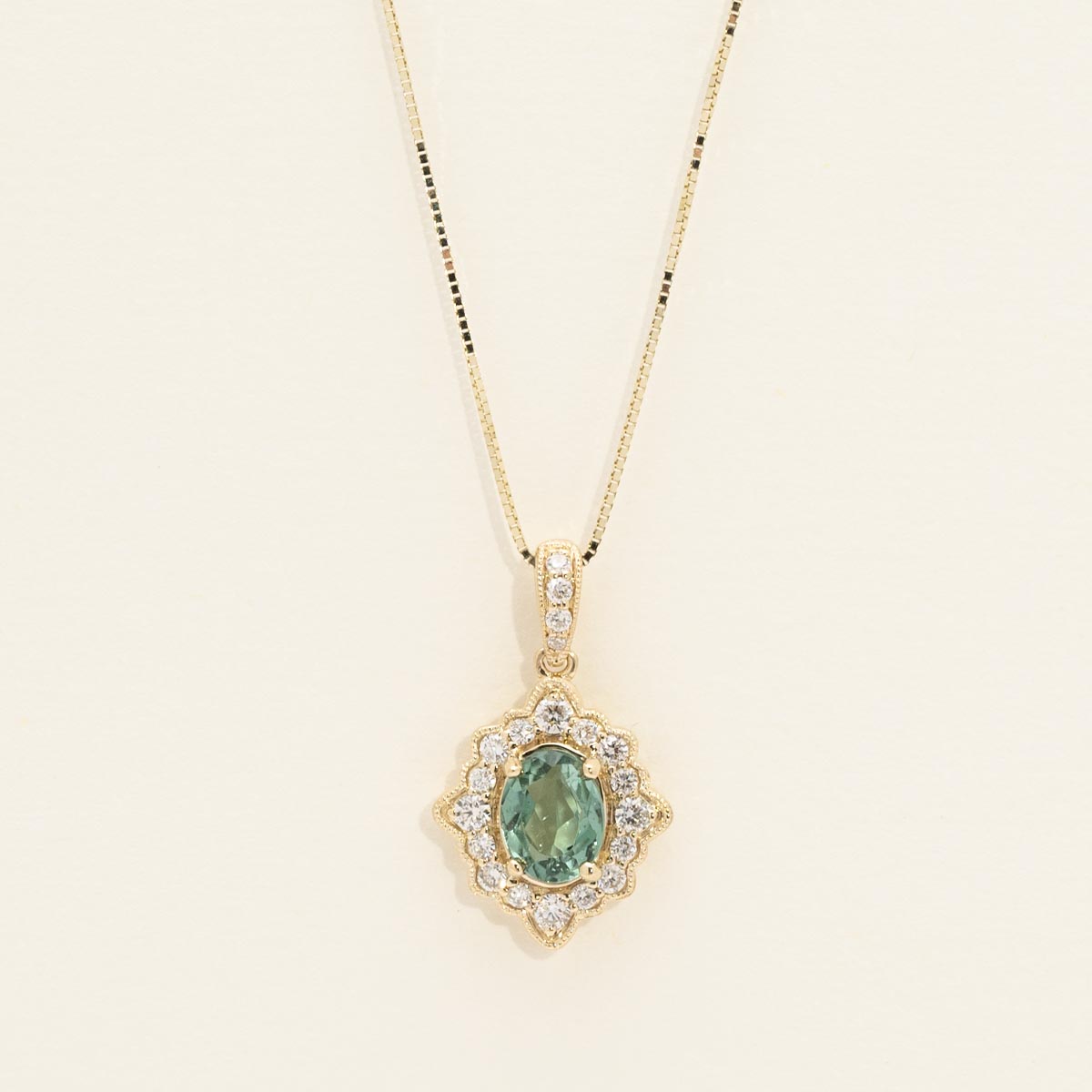 Maine Green Tourmaline Oval Halo Necklace in 14kt Yellow Gold with Diamonds (1/4ct tw)