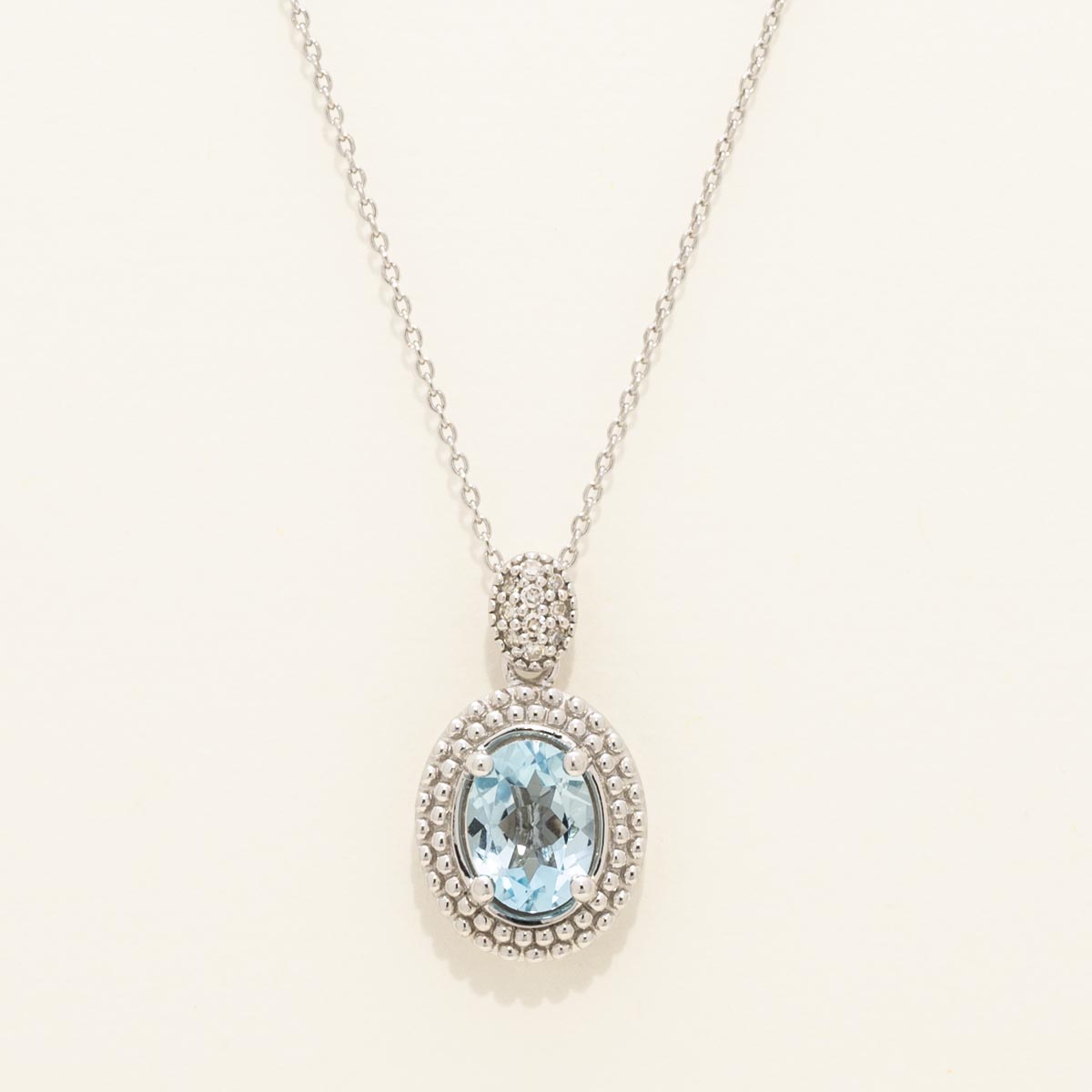 Oval Blue Topaz Necklace in Sterling Silver with Diamonds (1/20ct tw)