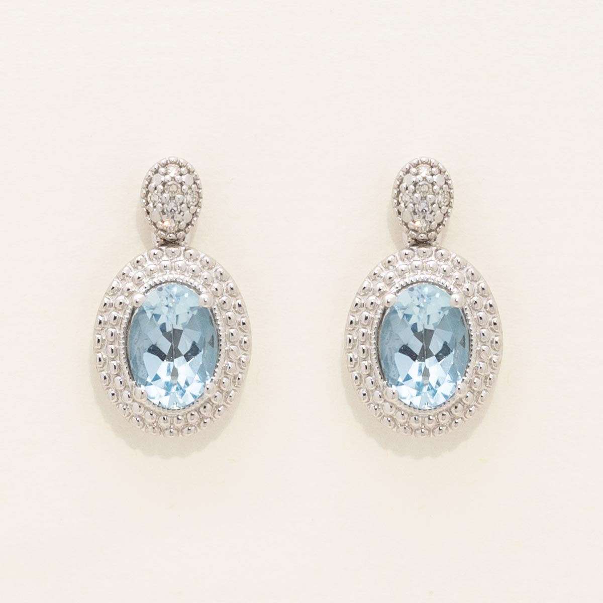 Oval Blue Topaz Drop Earrings in Sterling Silver with Diamonds (1/20ct tw)