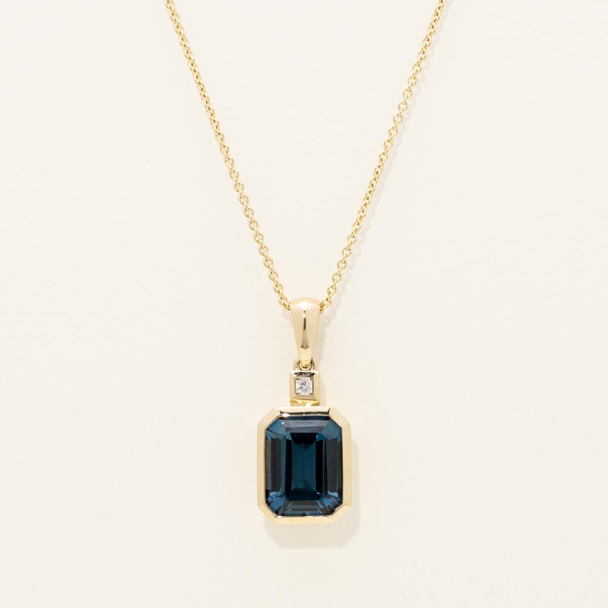 Emerald Cut London Blue Topaz Necklace in 14kt Yellow Gold with Diamond (.03ct tw)