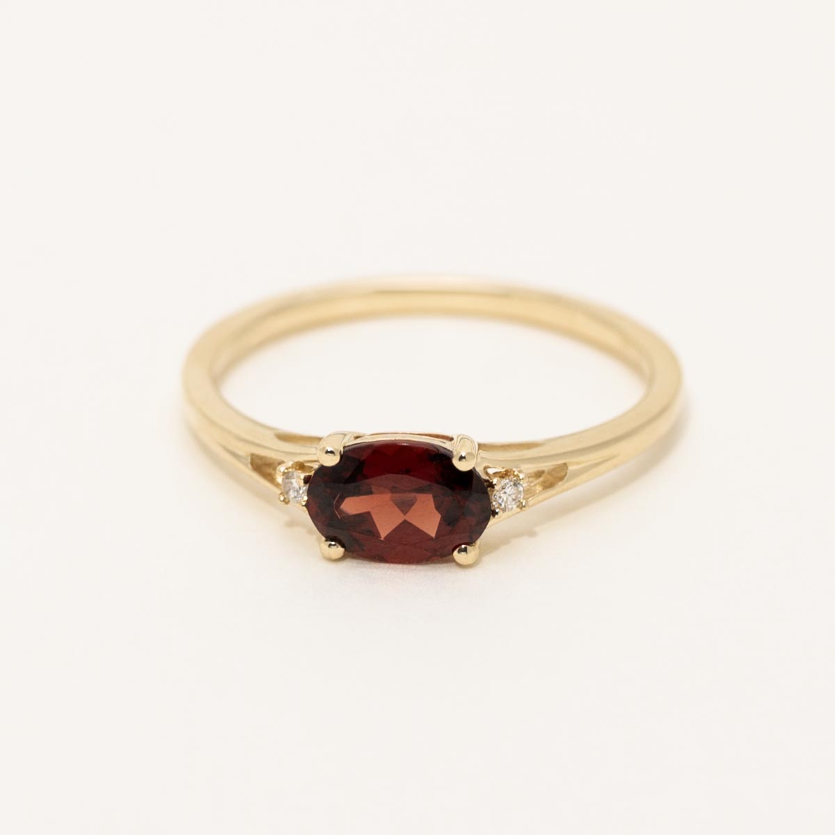 Oval Garnet Ring in 10kt Yellow Gold with Diamonds (.02ct tw)