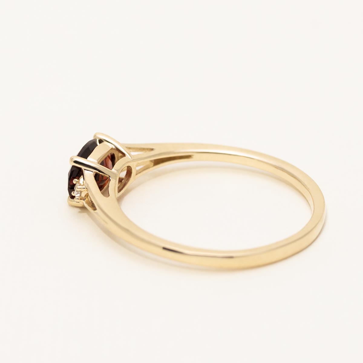 Oval Garnet Ring in 10kt Yellow Gold with Diamonds (.02ct tw)