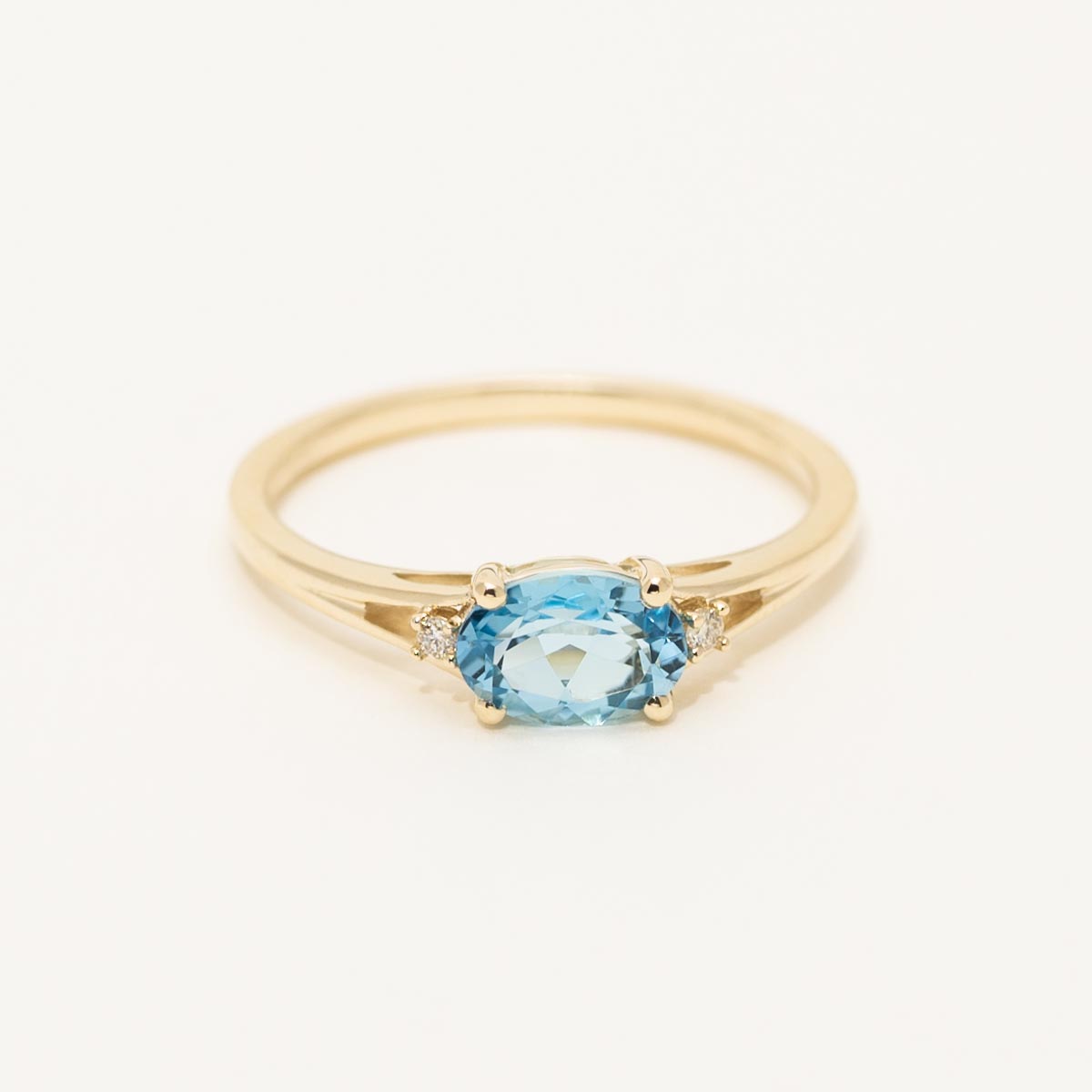 Oval Swiss Blue Topaz Ring in 10kt Yellow Gold with Diamonds (.02ct tw)