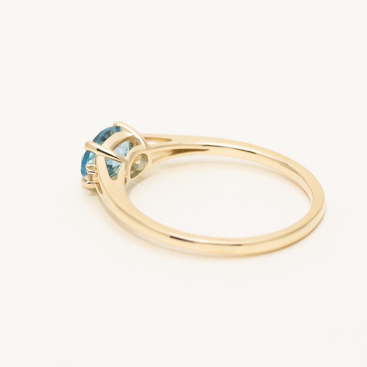 Oval Swiss Blue Topaz Ring in 10kt Yellow Gold with Diamonds (.02ct tw)