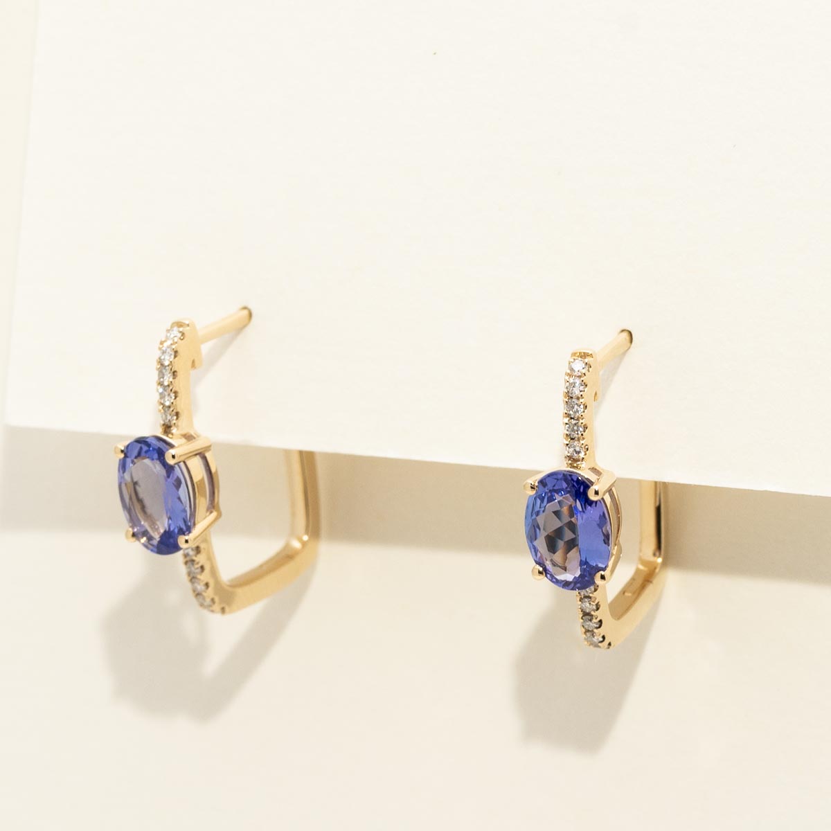 Oval Tanzanite Hoop Earrings in 14kt Yellow Gold with Diamonds (1/10ct tw)