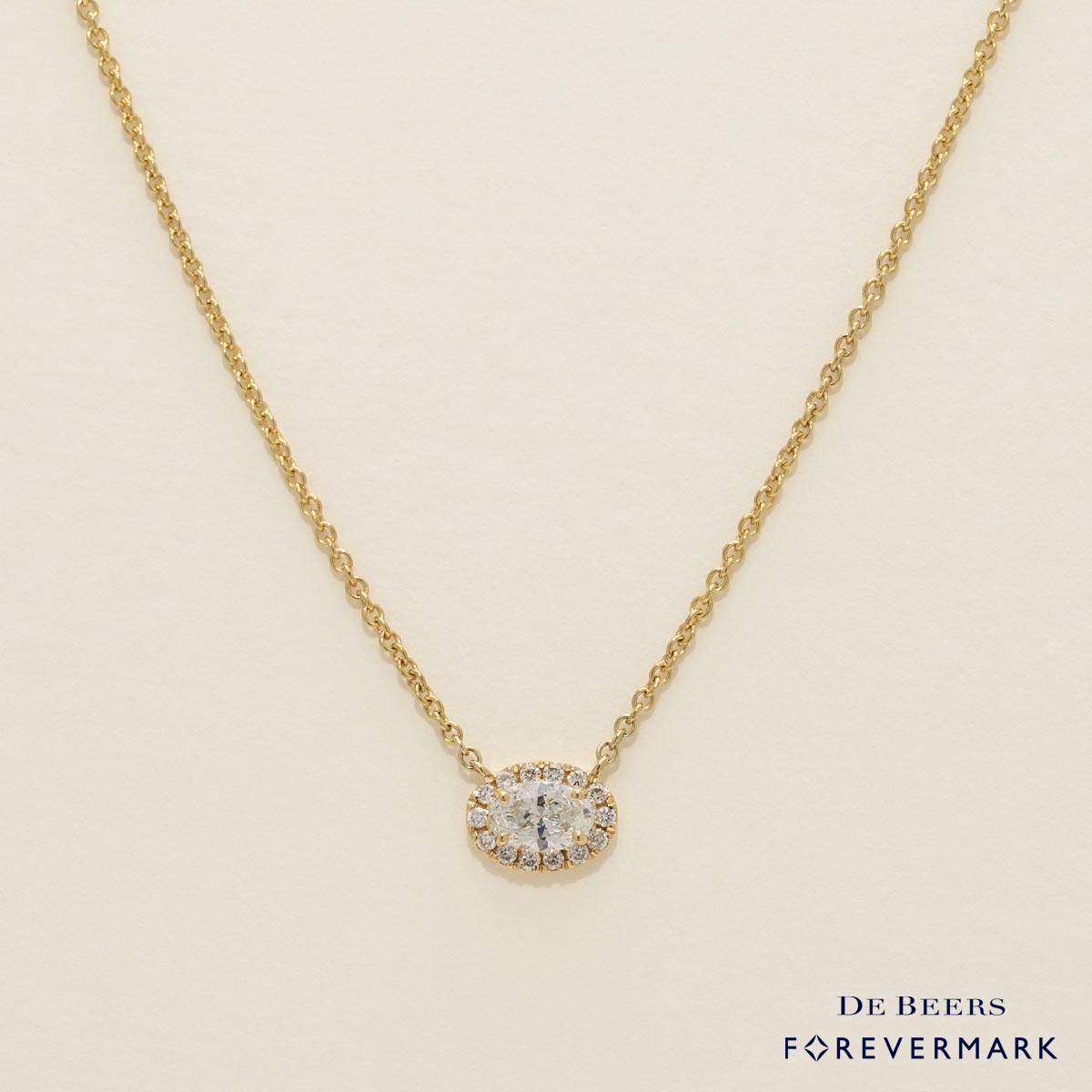 De Beers Forevermark Oval Diamond Halo Necklace in 18kt Yellow Gold (1/3ct tw)