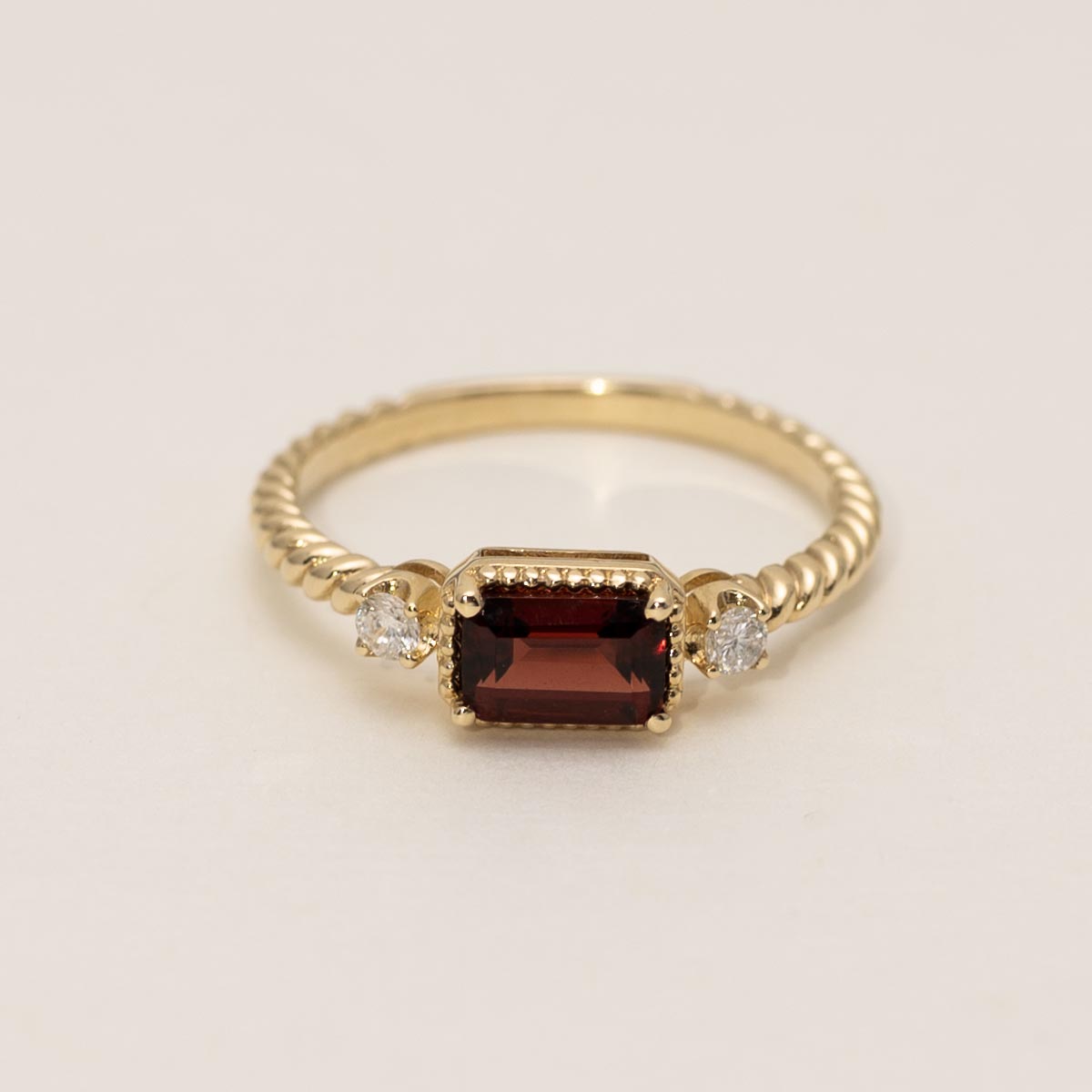 Emerald Cut Garnet Ring in 14kt Yellow Gold with Diamonds (1/10ct tw)