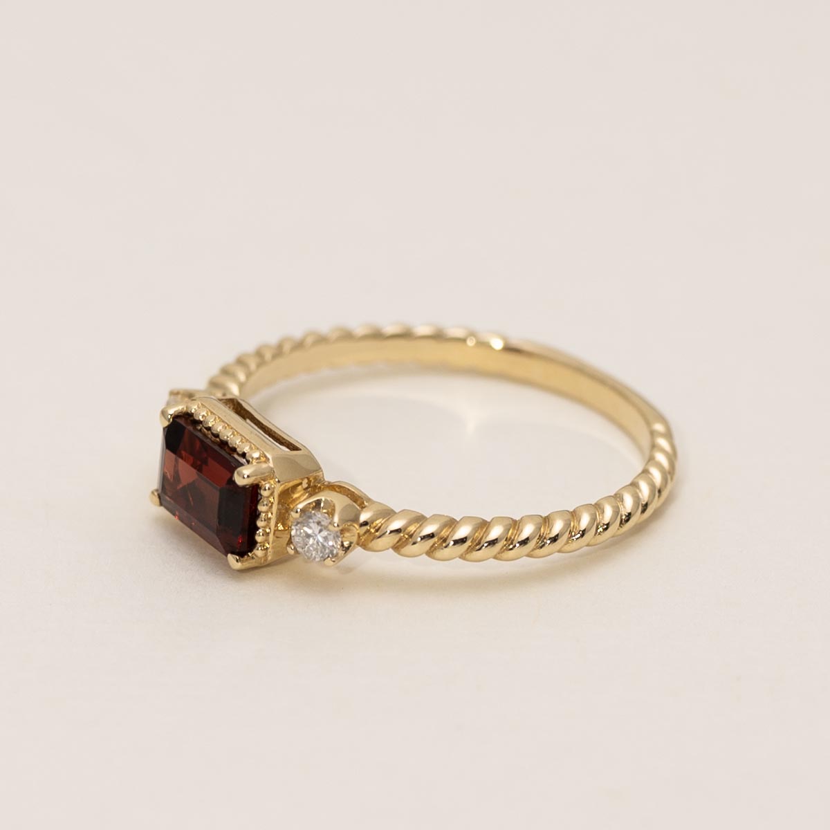 Emerald Cut Garnet Ring in 14kt Yellow Gold with Diamonds (1/10ct tw)
