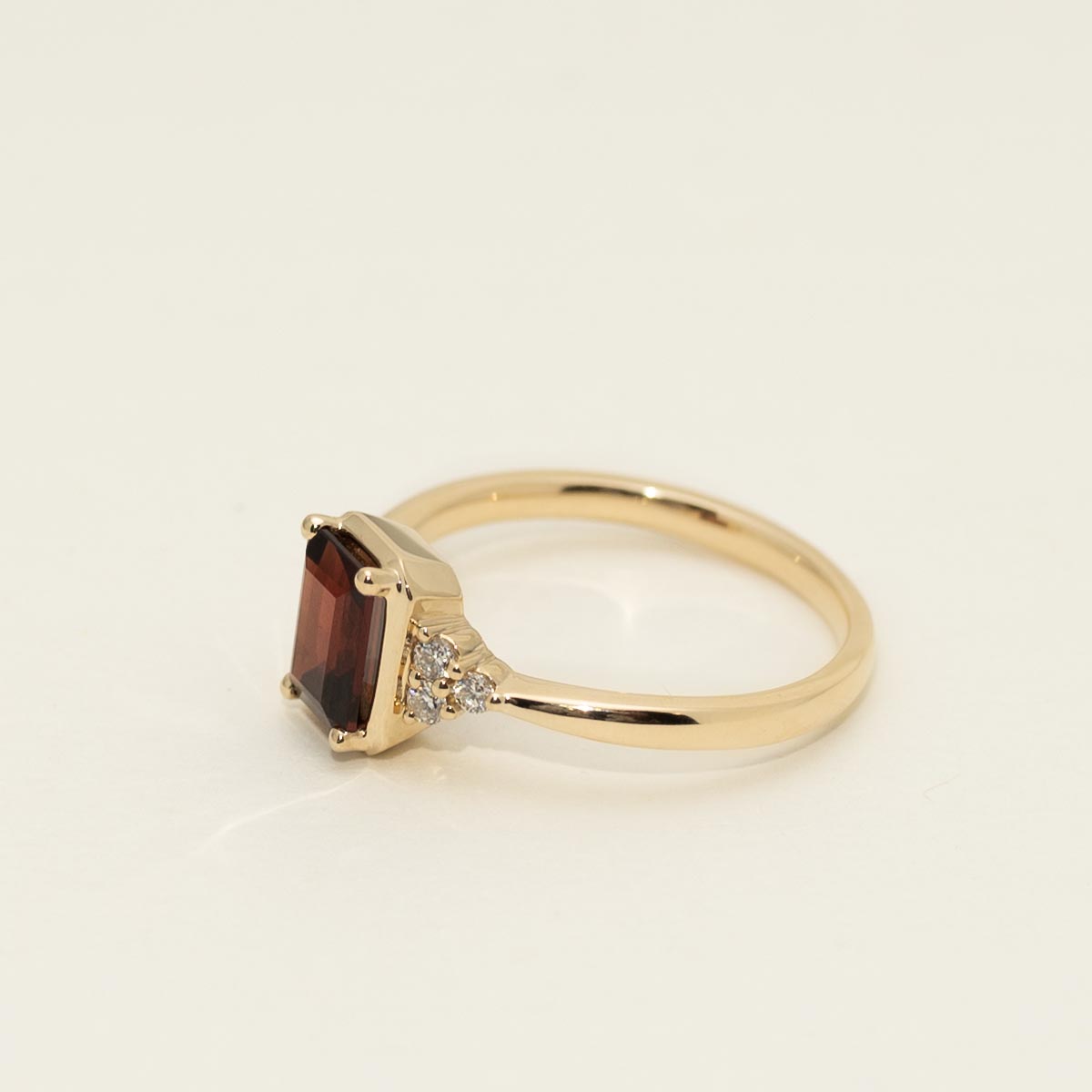 Emerald Cut Garnet Ring in 14kt Yellow Gold with Diamonds (1/10ct tw)
