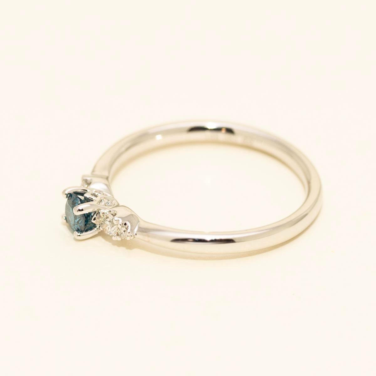 Blue Diamond engagement ring in 14kt white gold with diamond side stones