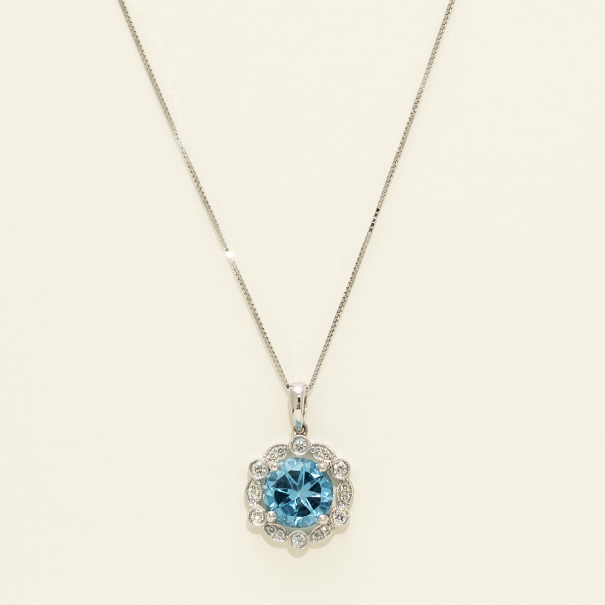 Blue Topaz Halo Necklace in 14kt White Gold with Diamonds (1/7ct tw)