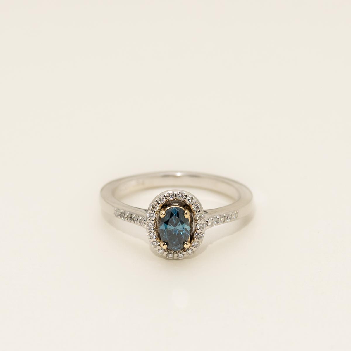 Oval Blue Diamond Halo Engagement Ring in 14kt White and Yellow Gold (1/2ct tw)