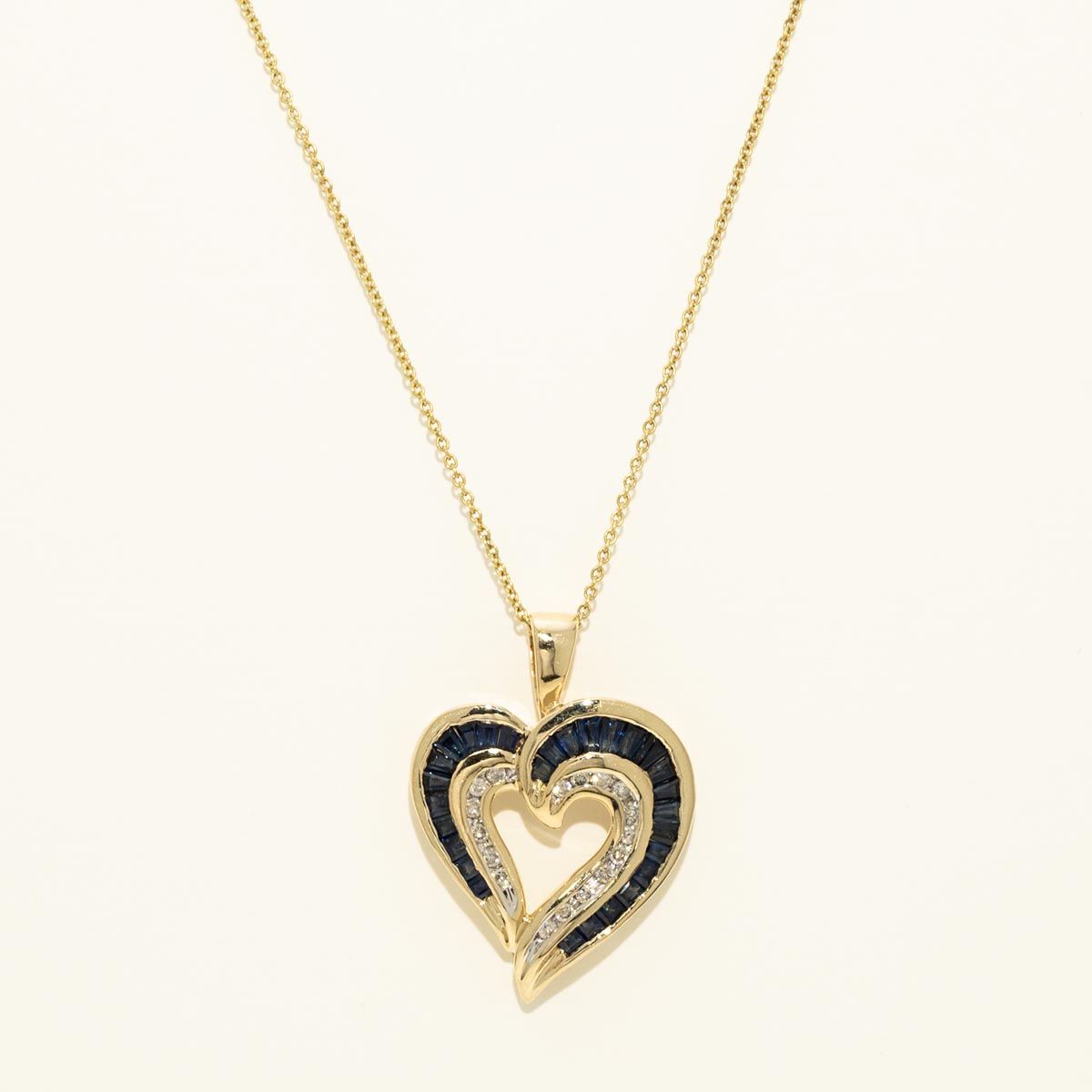 Estate Baguette Sapphire Heart Necklace in 14kt Yellow Gold with diamonds (1/10ct tw)
