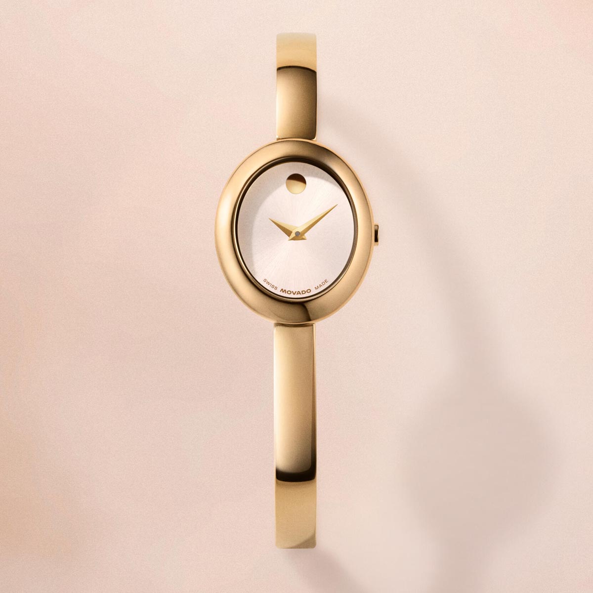 Movado Oval Bangle Womens Watch with White Dial and Gold Toned