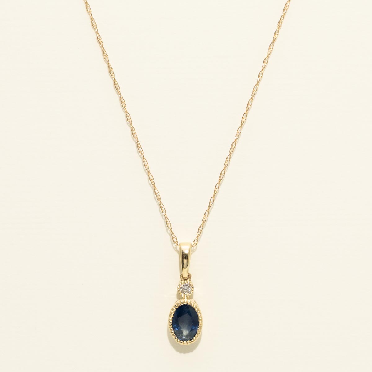 Oval Sapphire Bezel Necklace in 14kt Yellow Gold with Diamond (.03ct)