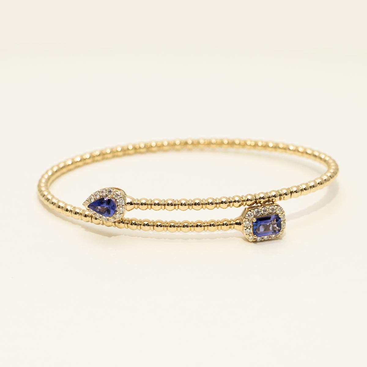 Emerald Cut and Pear Shape Tanzanite Flexible Bangle Bracelet in 14kt Yellow Gold with Diamonds (1 3/8ct tw)