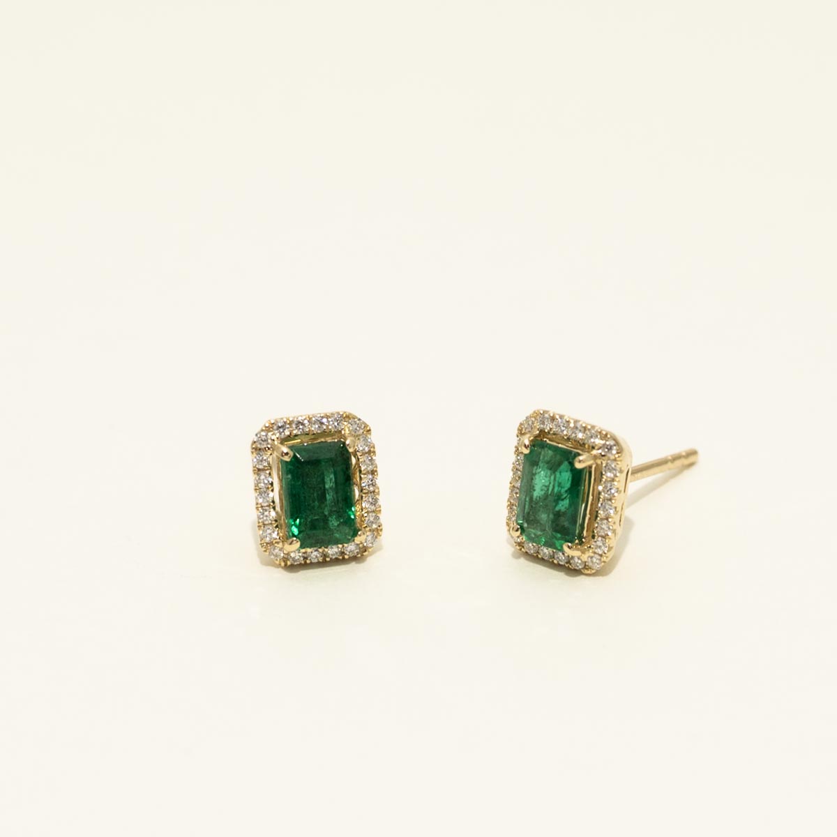 Emerald Cut Emerald Stud Earrings in 14kt Yellow Gold with Diamonds (1/5ct tw)