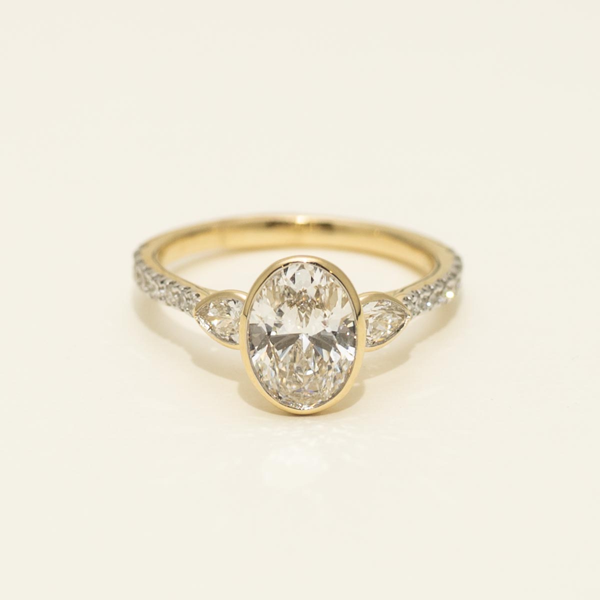 Lab Grown Oval Diamond Bezel Engagement Ring in 14kt Yellow Gold (2ct tw)