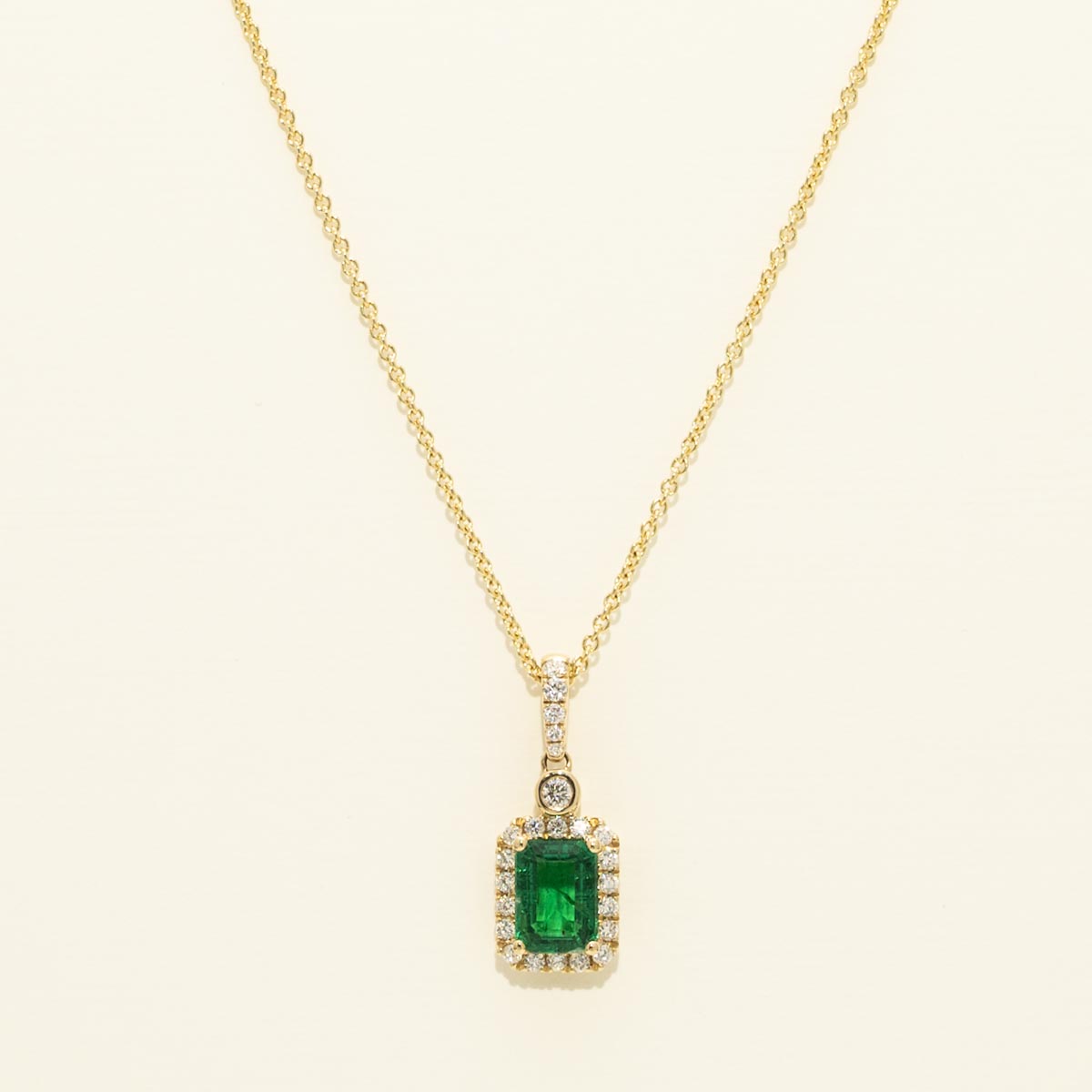 Emerald Halo Necklace with Diamonds in 14kt Yellow Gold (1/4ct tw)