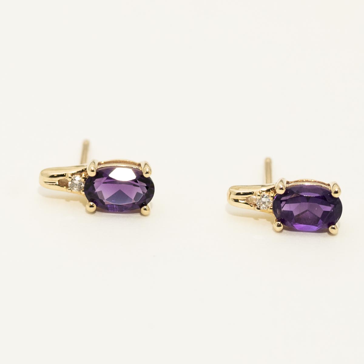 Oval Amethyst Earrings in 10kt Yellow Gold with Diamond (.02ct tw)