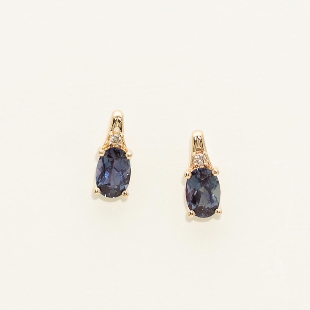 Oval Created Alexandrite Earrings in 10kt Yellow Gold with Diamonds (.02ct tw)