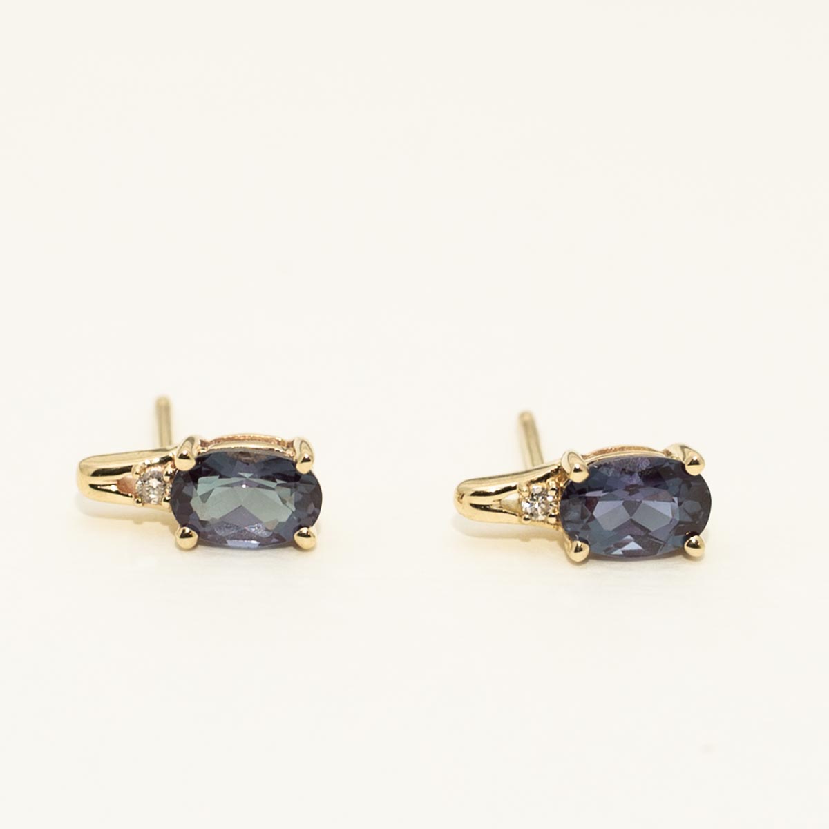 Oval Created Alexandrite Earrings in 10kt Yellow Gold with Diamonds (.02ct tw)