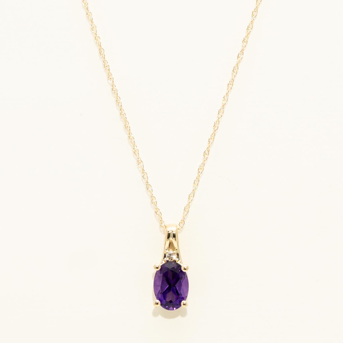 Oval Amethyst Necklace in 10kt Yellow Gold with Diamond (.01ct)