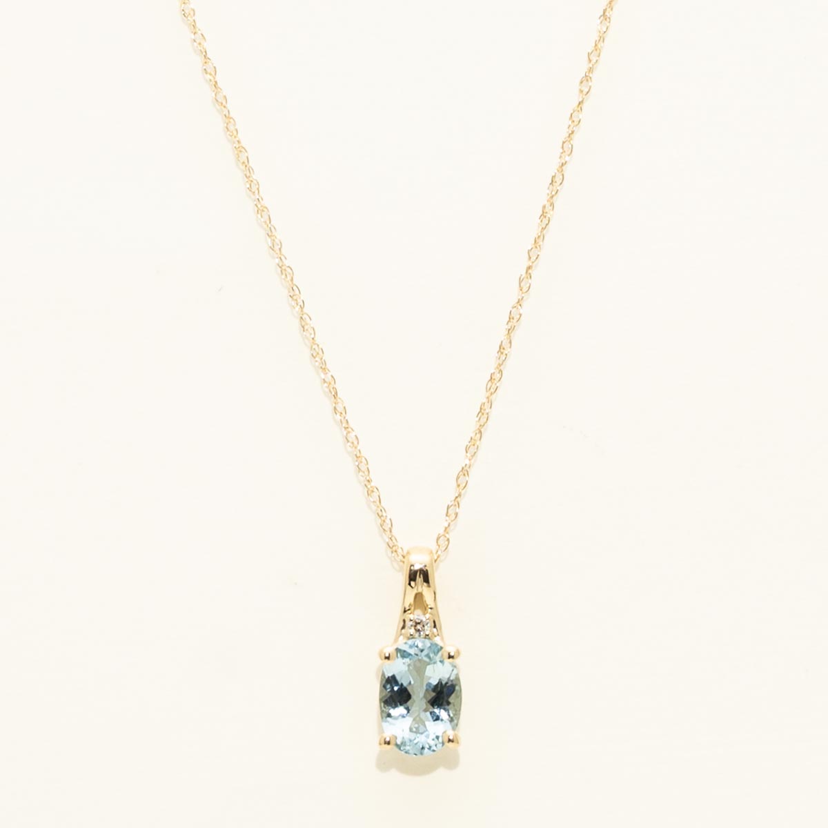 Oval Aquamarine Necklace in 10kt Yellow Gold with Diamond (.01ct)