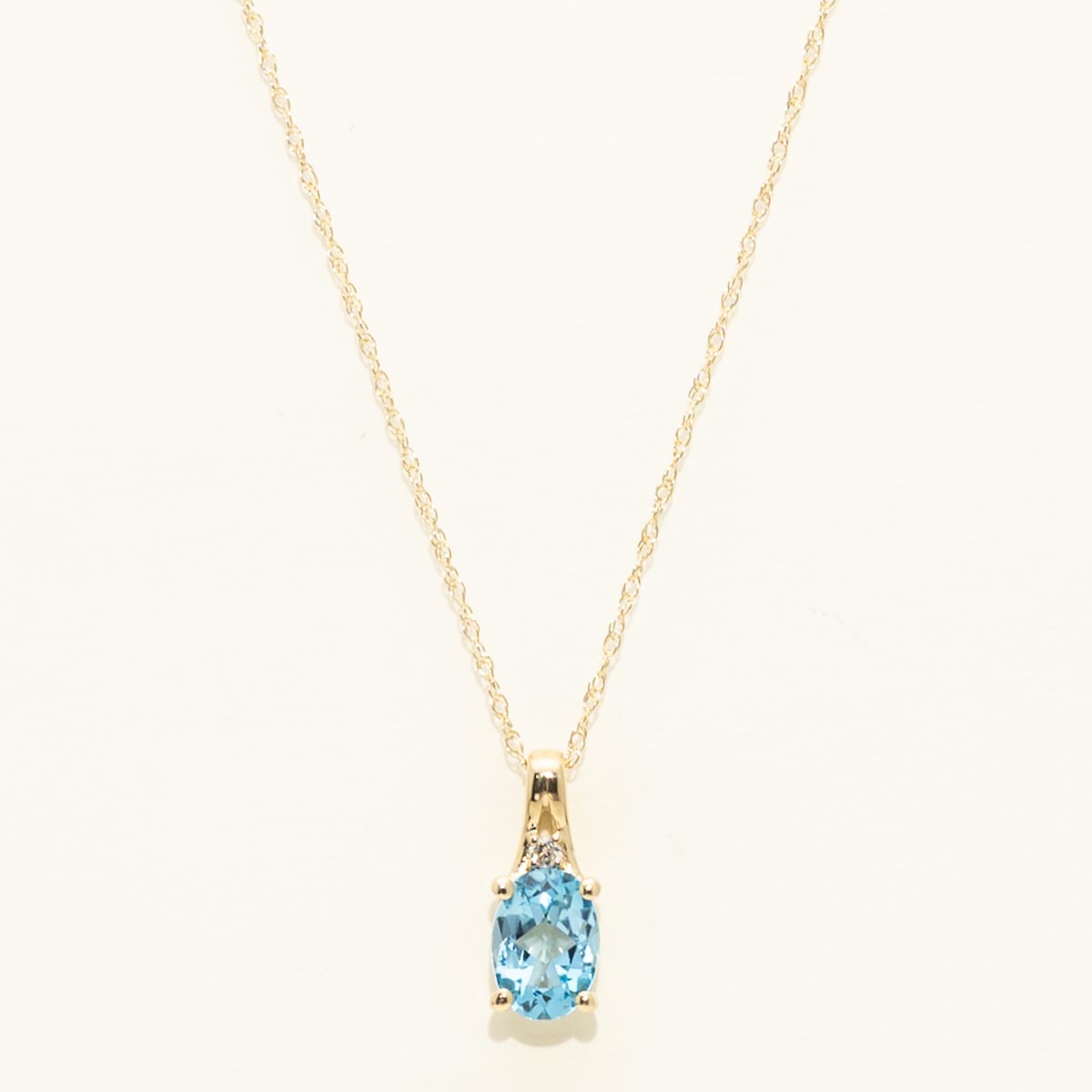 Oval Swiss Blue Topaz Necklace in 10kt Yellow Gold (.01ct)