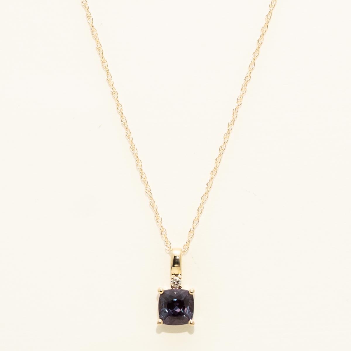 Cushion Cut Created Alexandrite Necklace in 10kt Yellow Gold with Diamond (.01ct)