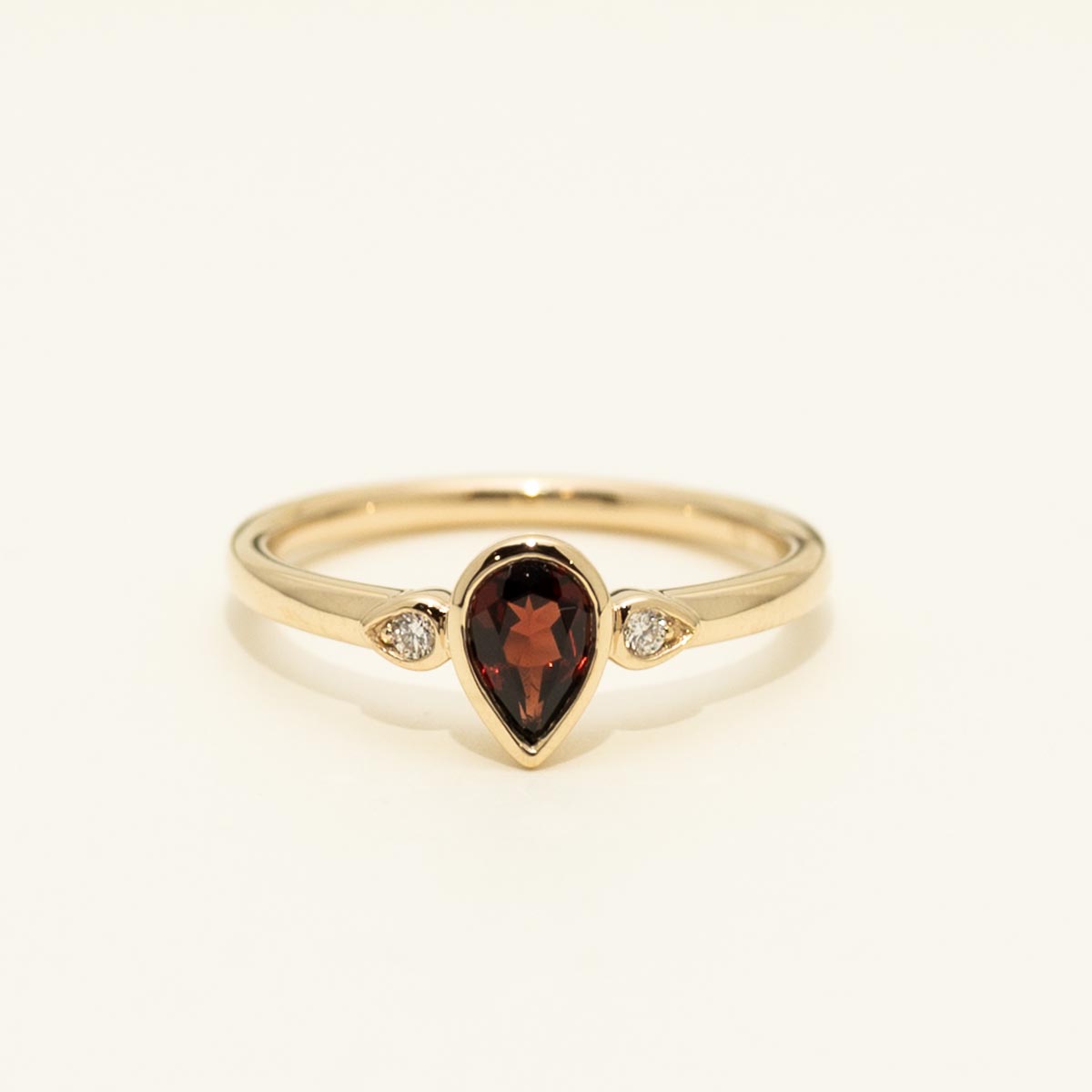Pear Shaped Garnet Ring in 14kt Yellow Gold with Diamonds (.03ct tw)