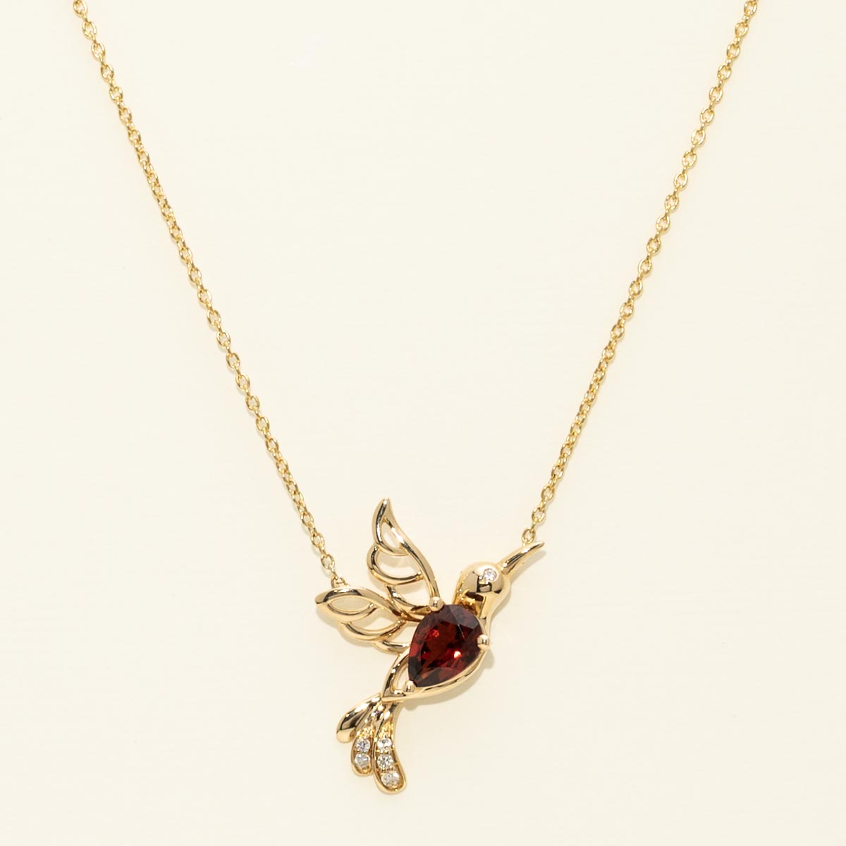 Pear Shaped Garnet Hummingbird Necklace in 14kt Yellow Gold with Diamonds (.04ct tw)