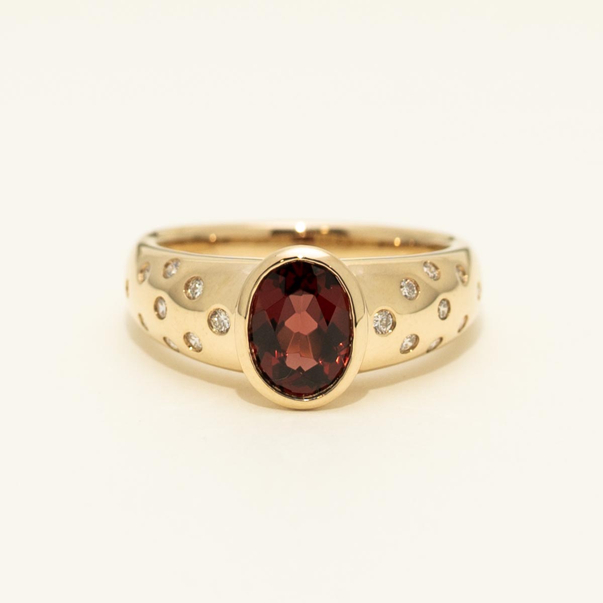 Oval Garnet Ring in 14kt Yellow Gold with Diamonds (1/7ct tw)