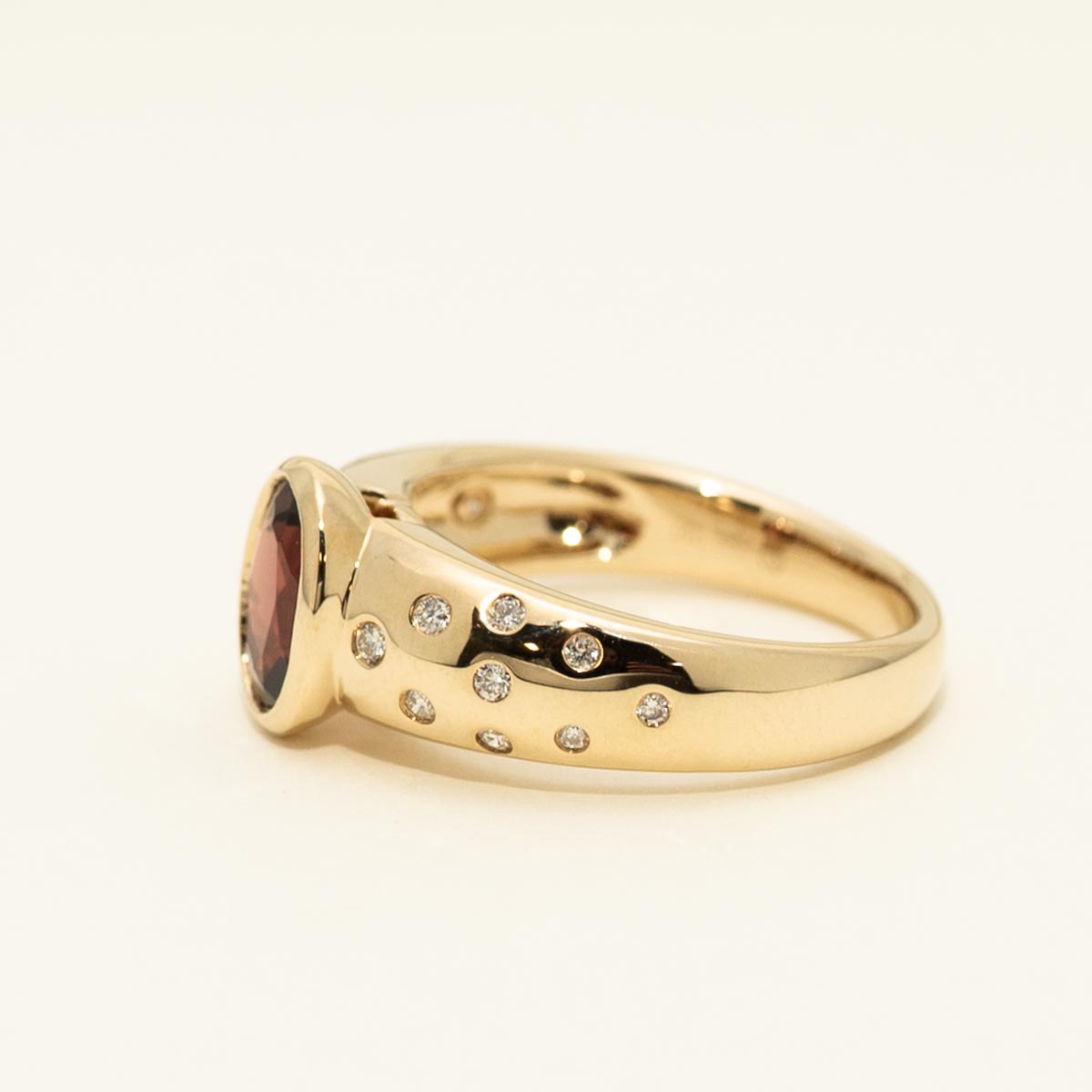 Oval Garnet Ring in 14kt Yellow Gold with Diamonds (1/7ct tw)