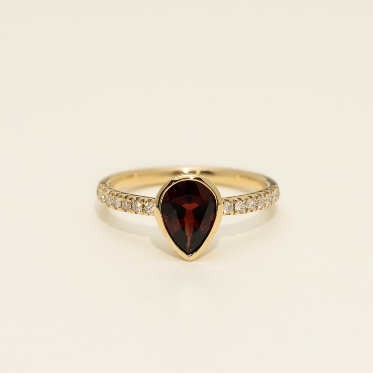 Pear Shape Garnet Bezel Ring in 14kt Yellow Gold with Diamonds (1/7ct tw)