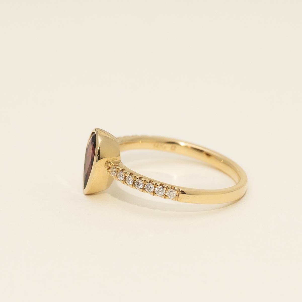 Pear Shape Garnet Bezel Ring in 14kt Yellow Gold with Diamonds (1/7ct tw)