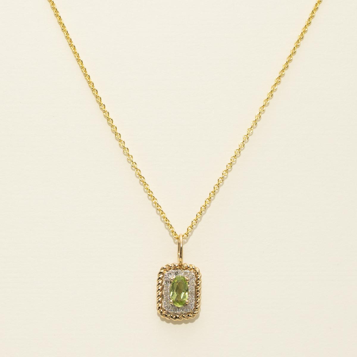 Madison L Oval Peridot Necklace in 14kt Yellow Gold with Diamonds (1/20ct tw)