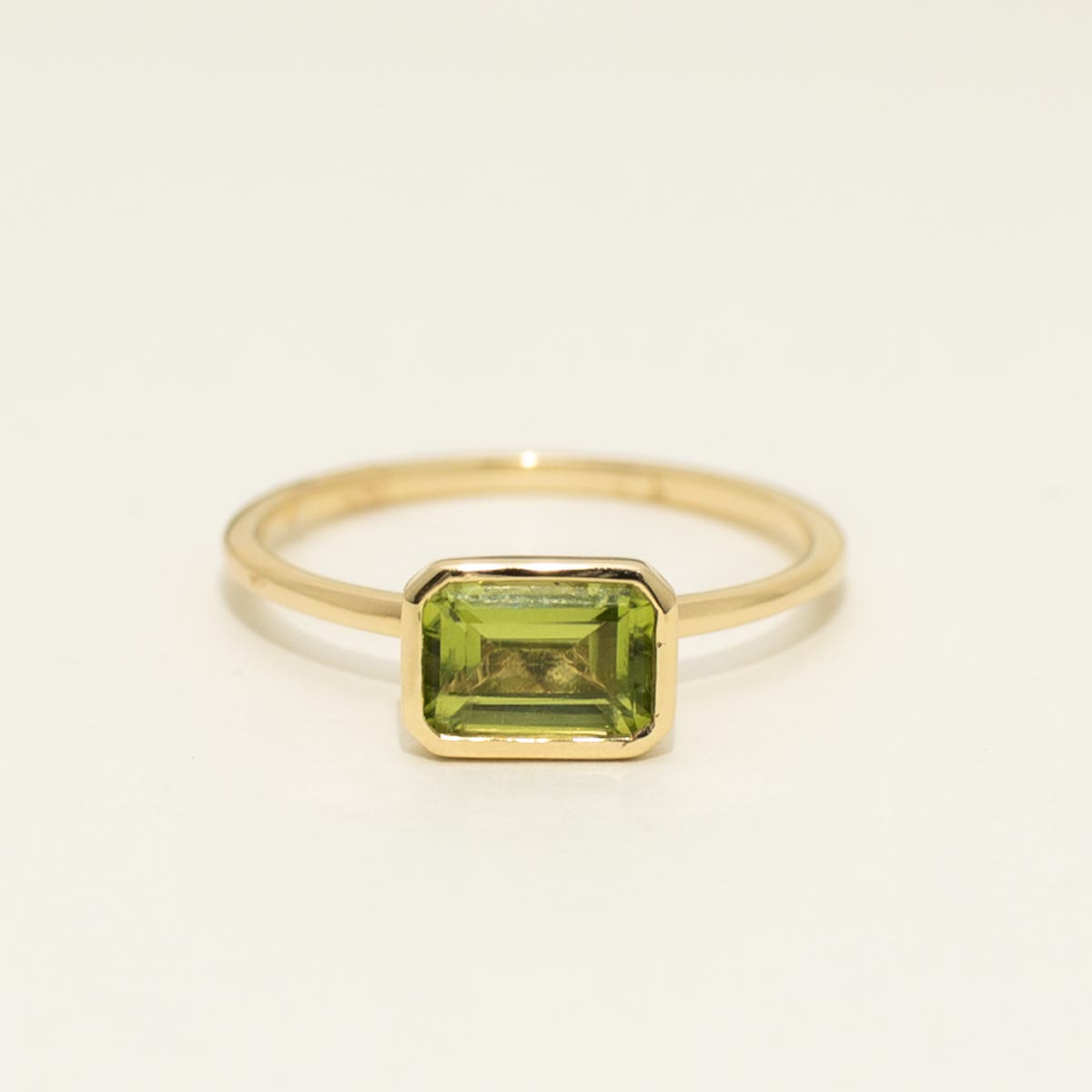 Madison L Emerald Cut Peridot Bezel Ring in 14kt Yellow Gold
