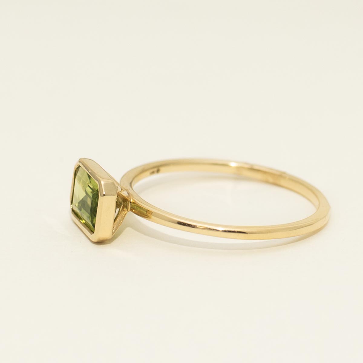 Madison L Emerald Cut Peridot Bezel Ring in 14kt Yellow Gold