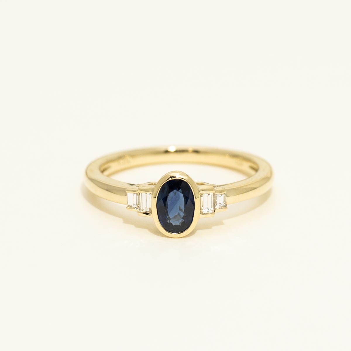 Oval Sapphire Bezel Ring in 14kt Yellow Gold with Diamonds (1/10ct tw)