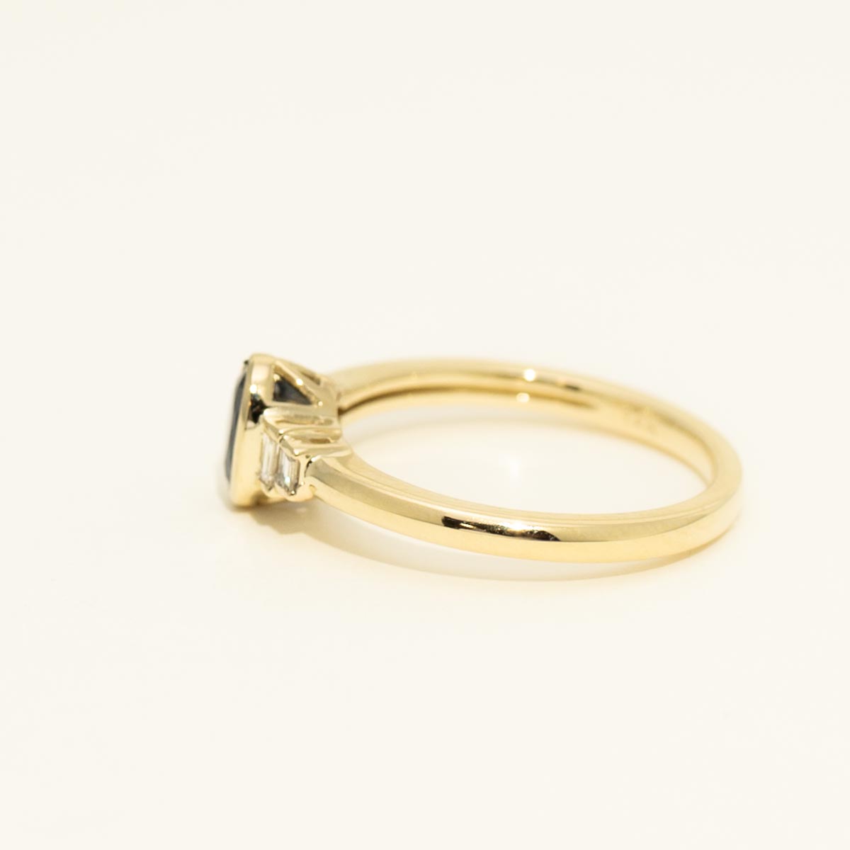 Oval Sapphire Bezel Ring in 14kt Yellow Gold with Diamonds (1/10ct tw)
