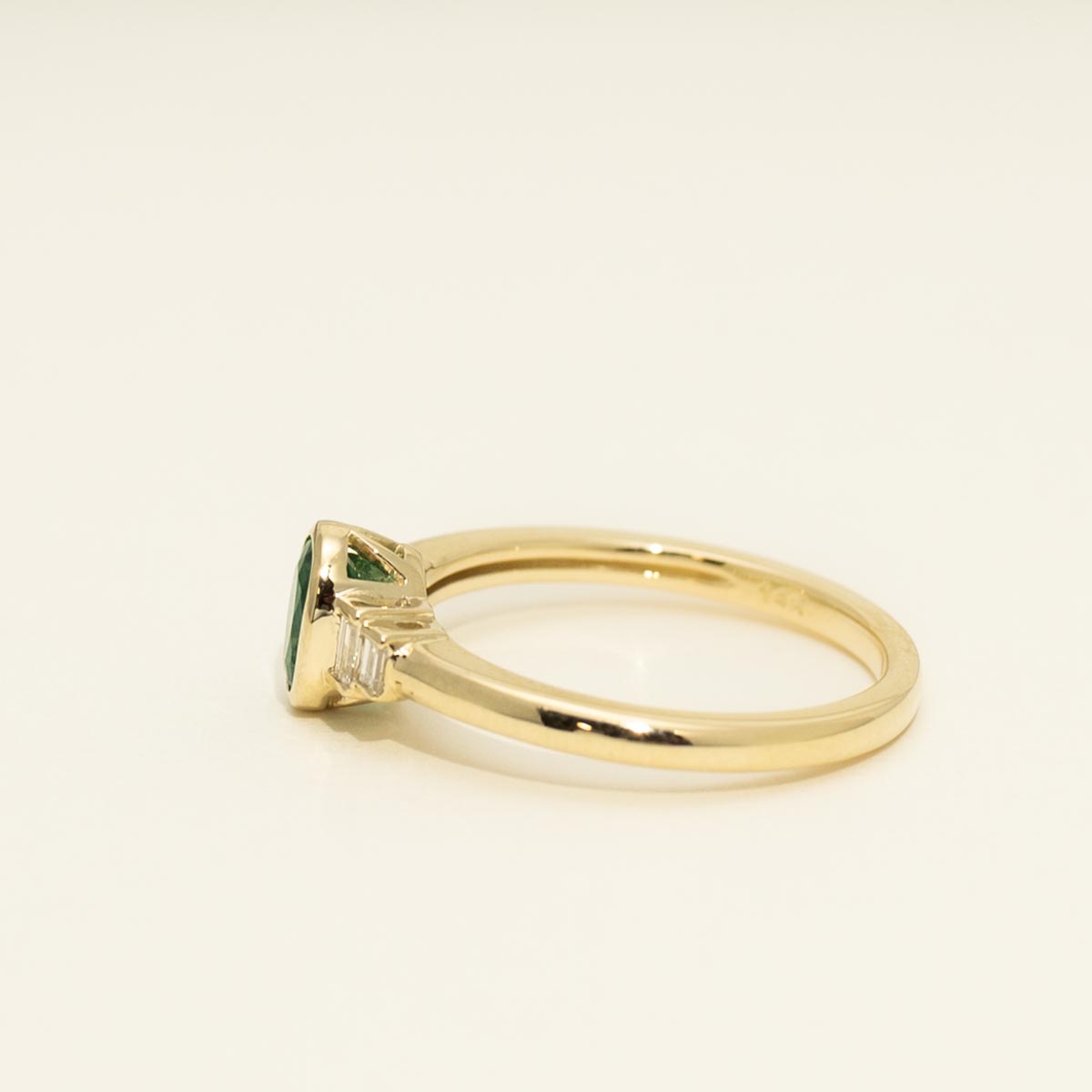 Oval Emerald Bezel Ring in 14kt Yellow Gold with Diamonds (1/10ct tw)