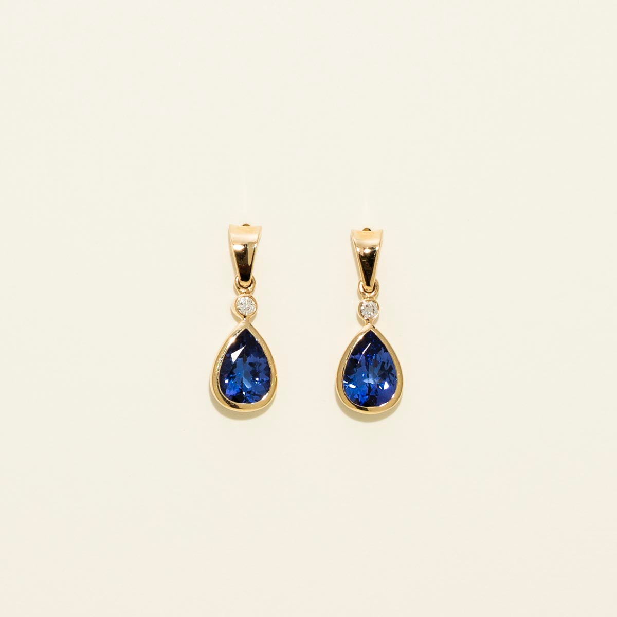 Pear Shaped Tanzanite Drop Earrings in 14kt Yellow Gold with Diamonds (1/20ct tw)