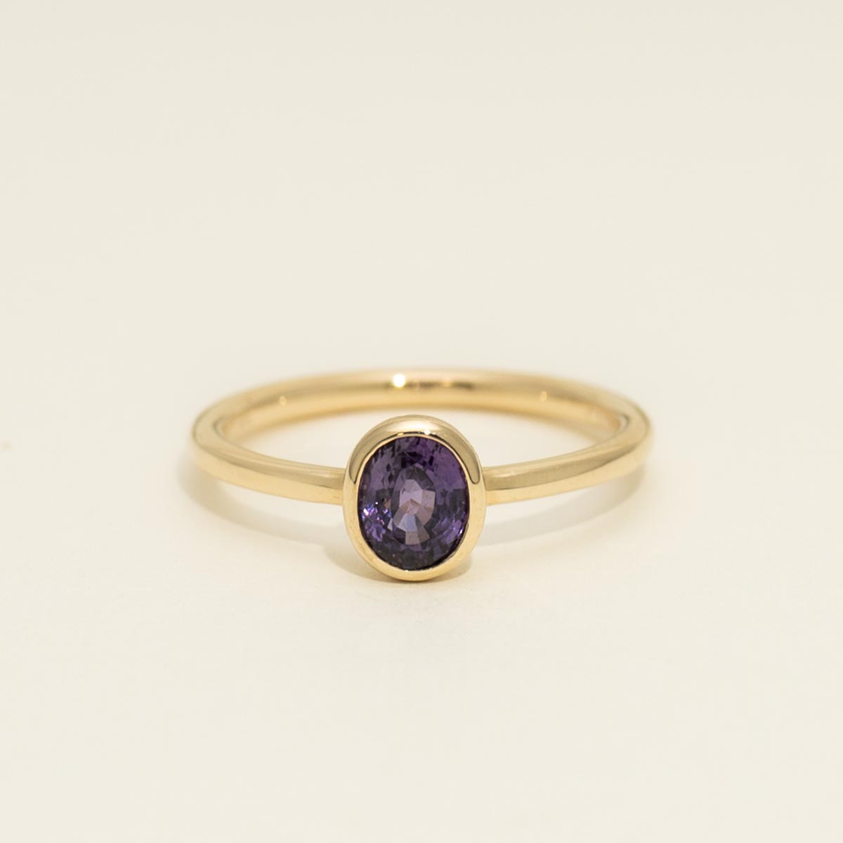 Oval Purple Sapphire Bezel Ring in 14kt Yellow Gold