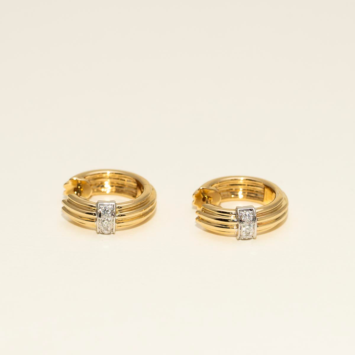 Diamond Hoop Earrings in 14kt Yellow and White Gold (1/10ct tw)