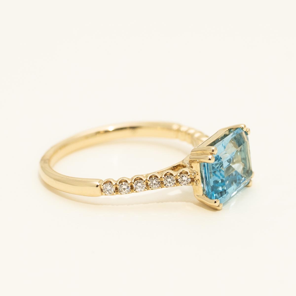 Madison L Essentials Emerald Cut Blue Topaz Ring in 14kt Yellow Gold with Diamonds (1/7ct tw)